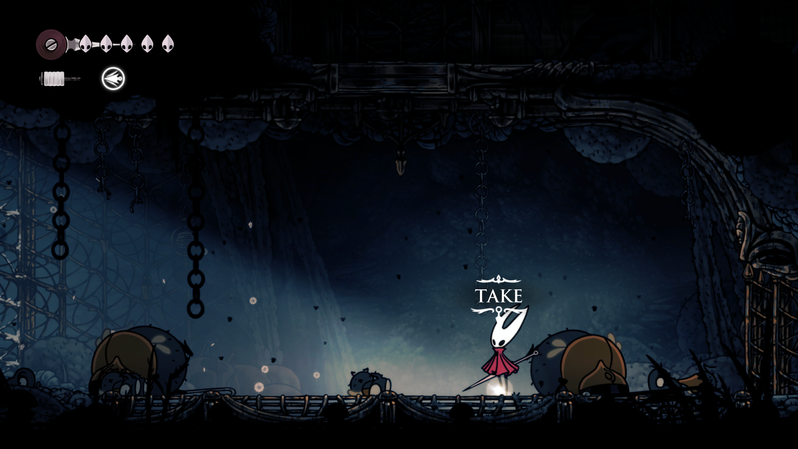 چگونه از منطقه The Slab در Silksong فرار کنیم 4 A screenshot of Hollow Knight: Silksong. A short character with a red cloak and a white head stands in a dark room with sunlight filtering in through chains on the left. A glowing white item is at her feet with a prompt that says TAKE.