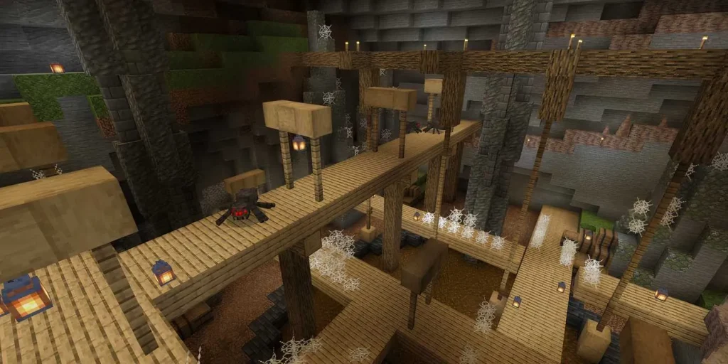 imgi 1 a spider sits on a walkway in a giant cave in minecraft